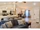 Spacious living room flows into the kitchen, complete with stylish furniture and bright lighting at 10 Banyan Track Way, Ocala, FL 34472