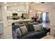 Open-concept living area with kitchen, dining, and living spaces, featuring modern decor and ample natural light at 10 Banyan Track Way, Ocala, FL 34472