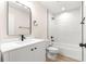 Modern bathroom featuring white marble tile shower and matte black fixtures at 10605 Se 146Th Ln, Summerfield, FL 34491