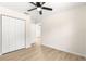 Bright bedroom offering ample closet space and a view of the hallway at 10605 Se 146Th Ln, Summerfield, FL 34491
