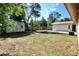 Backyard with a shed, patio, and views of the home's exterior at 1145 Se 32Nd Ave, Ocala, FL 34471