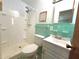 Retro bathroom with a stall shower, vintage green tile, and classic fixtures at 1145 Se 32Nd Ave, Ocala, FL 34471