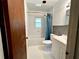 Bright bathroom featuring a shower-tub combo with tiled walls and a modern vanity at 1145 Se 32Nd Ave, Ocala, FL 34471
