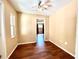 Bedroom with hardwood flooring, fan, and window at 1145 Se 32Nd Ave, Ocala, FL 34471