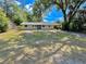 Charming single-story home with a large front yard and mature trees at 1145 Se 32Nd Ave, Ocala, FL 34471