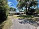 A view of the front of the home, highlighting its simple design and green yard at 1145 Se 32Nd Ave, Ocala, FL 34471
