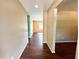 Hallway showing laminate floors and access to other rooms at 1145 Se 32Nd Ave, Ocala, FL 34471