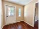 Mud room with back door and hardwood flooring at 1145 Se 32Nd Ave, Ocala, FL 34471