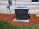 Outside Carrier air conditioning unit with mulched base and greenery at 11536 Sw 138Th Ln, Dunnellon, FL 34432
