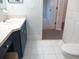 Bathroom featuring a vanity and a toilet, with access to another room at 11536 Sw 138Th Ln, Dunnellon, FL 34432