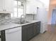 Kitchen featuring a stainless steel appliance, and gray countertops, complemented by sleek, modern cabinetry at 11536 Sw 138Th Ln, Dunnellon, FL 34432
