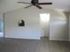 Neutral living room with modern flooring, ceiling fan, bright natural light, and open layout at 11536 Sw 138Th Ln, Dunnellon, FL 34432