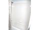 All white tiled shower with decorative curtain and shower head at 11536 Sw 138Th Ln, Dunnellon, FL 34432