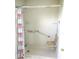 Walk-in shower featuring grab bars and a fold-down bench at 11536 Sw 138Th Ln, Dunnellon, FL 34432