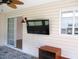 Bright sunroom with wall-mounted television, and sliding glass doors at 11536 Sw 138Th Ln, Dunnellon, FL 34432