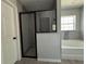 Bathroom showcasing a glass-enclosed shower and soaking tub with stylish tile accents at 1233 Sw Winding Hills Rd, Dunnellon, FL 34431