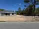Beautifully landscaped lot backing to a wooded area, creating a private, serene outdoor space at 1233 Sw Winding Hills Rd, Dunnellon, FL 34431