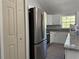 Modern kitchen featuring stainless steel appliances, white cabinets, and granite countertops at 1233 Sw Winding Hills Rd, Dunnellon, FL 34431