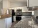 Well-equipped kitchen with granite counters, stainless steel appliances, and ample cabinet space at 1233 Sw Winding Hills Rd, Dunnellon, FL 34431
