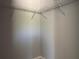 A walk-in closet with installed wire shelving and neutral paint, providing ample storage space at 1233 Sw Winding Hills Rd, Dunnellon, FL 34431