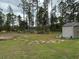 Spacious backyard featuring a storage shed and a partially wooded area at 13356 Sw 66Th St, Ocala, FL 34481