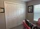 Bedroom featuring a closet with folding doors, a cozy chair and a bright pink desk at 13356 Sw 66Th St, Ocala, FL 34481