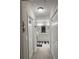 Hallway leading to a bathroom with dual vanity and framed by closets on either side at 13356 Sw 66Th St, Ocala, FL 34481