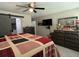 Comfortable main bedroom with ceiling fan and plenty of dresser space, including a wall-mounted television at 13356 Sw 66Th St, Ocala, FL 34481