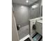 Modern bathroom with a tiled stand-up shower, glass partition, and neutral color palette at 13356 Sw 66Th St, Ocala, FL 34481
