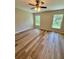 Bedroom with ceiling fan and lots of natural light from two windows at 13506 Sw 114Th Ln, Dunnellon, FL 34432