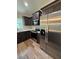 Close up of modern kitchen featuring stainless steel appliances and wooden cabinets at 13506 Sw 114Th Ln, Dunnellon, FL 34432