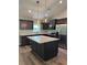 Modern kitchen with stainless steel appliances, island, and wooden cabinets at 13506 Sw 114Th Ln, Dunnellon, FL 34432
