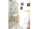 Updated bathroom featuring a modern glass shower and toilet at 13675 Sw 111Th Ave, Dunnellon, FL 34432