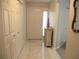 Entryway with tile floors, closet, and decorative cabinet with an American flag at 13675 Sw 111Th Ave, Dunnellon, FL 34432