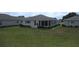 Cozy single-story home featuring screened porch, manicured lawn, and well-maintained landscaping at 13675 Sw 111Th Ave, Dunnellon, FL 34432