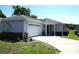 Charming single-story home featuring a well-maintained lawn and an attached two-car garage at 13675 Sw 111Th Ave, Dunnellon, FL 34432