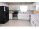 Bright kitchen featuring white cabinets, stainless steel appliances, and a modern design at 13675 Sw 111Th Ave, Dunnellon, FL 34432