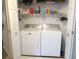 Laundry room featuring a washer, dryer, and shelving at 13675 Sw 111Th Ave, Dunnellon, FL 34432