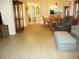 Open floor plan with dining area showcases tile flooring, modern furniture, and natural light at 13675 Sw 111Th Ave, Dunnellon, FL 34432