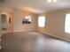 Open concept living room with modern light fixture and neutral walls providing a versatile living space at 13675 Sw 111Th Ave, Dunnellon, FL 34432