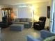 Comfortable living room with plush seating, ample lighting, and stylish decor at 13675 Sw 111Th Ave, Dunnellon, FL 34432