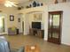 Bright living room featuring stylish decor, a display cabinet, and comfortable furniture at 13675 Sw 111Th Ave, Dunnellon, FL 34432