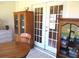 Sun room featuring tile floors, wood furniture, and sliding glass doors at 13675 Sw 111Th Ave, Dunnellon, FL 34432
