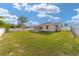 Spacious backyard showing a home with ample green space and a patio at 14085 Sw 34Th Terrace Rd, Ocala, FL 34473