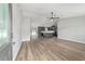 Open-concept living room flows into the kitchen, featuring durable wood-look flooring and modern lighting at 14085 Sw 34Th Terrace Rd, Ocala, FL 34473