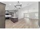 Open-concept floorplan shows kitchen, dining, and living area with lots of natural light and modern flooring at 14085 Sw 34Th Terrace Rd, Ocala, FL 34473