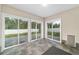 Sunroom featuring tile flooring and large sliding glass doors providing access and views of the backyard at 14085 Sw 34Th Terrace Rd, Ocala, FL 34473
