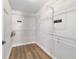 Bright walk-in closet featuring wire shelving, wood-look floors and a safe at 14085 Sw 34Th Terrace Rd, Ocala, FL 34473