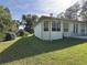 Lush backyard features a well-kept lawn, mature trees, and privacy at 19059 Sw 92Nd Loop, Dunnellon, FL 34432
