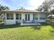 Well-maintained backyard with a patio and outdoor seating, perfect for entertaining at 19059 Sw 92Nd Loop, Dunnellon, FL 34432